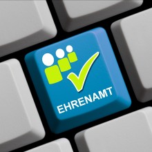 Computertaste mit Ehrenamts-Symbol